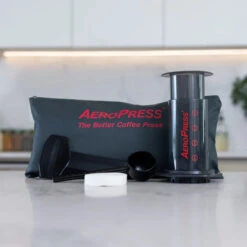 AeroPress Original Coffee Maker -Kitchen Supplies Store aeropress coffee maker with tote front 700x 9ea5aab7 4217 4ee1 ac11 f9eee615fc32